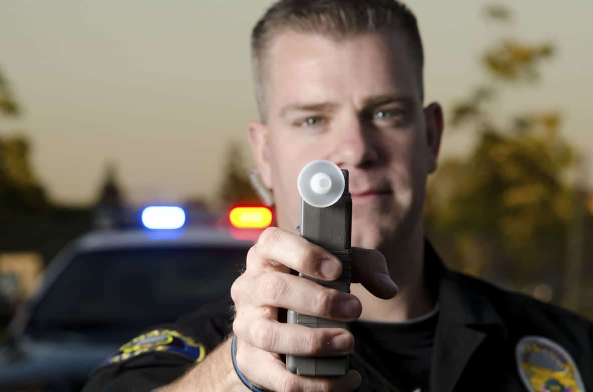 police officer with breathalyser