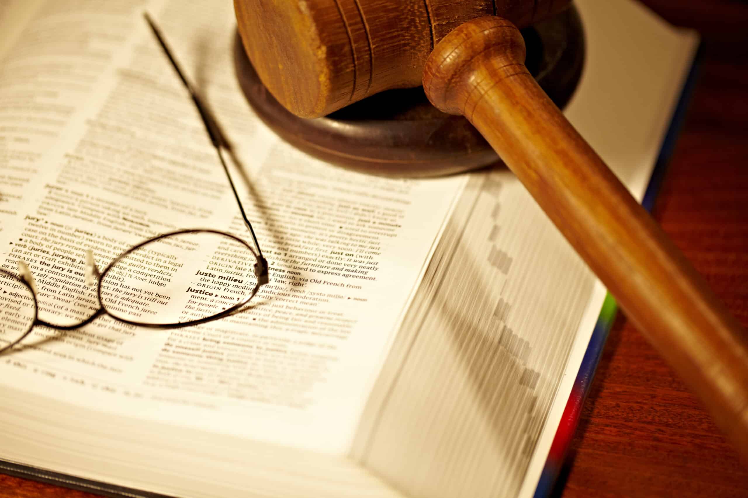 https://filkowlaw.com/wp-content/uploads/2023/05/the-meaning-of-justice-an-open-book-with-a-gavel-2022-12-24-03-49-42-utc-scaled.jpg